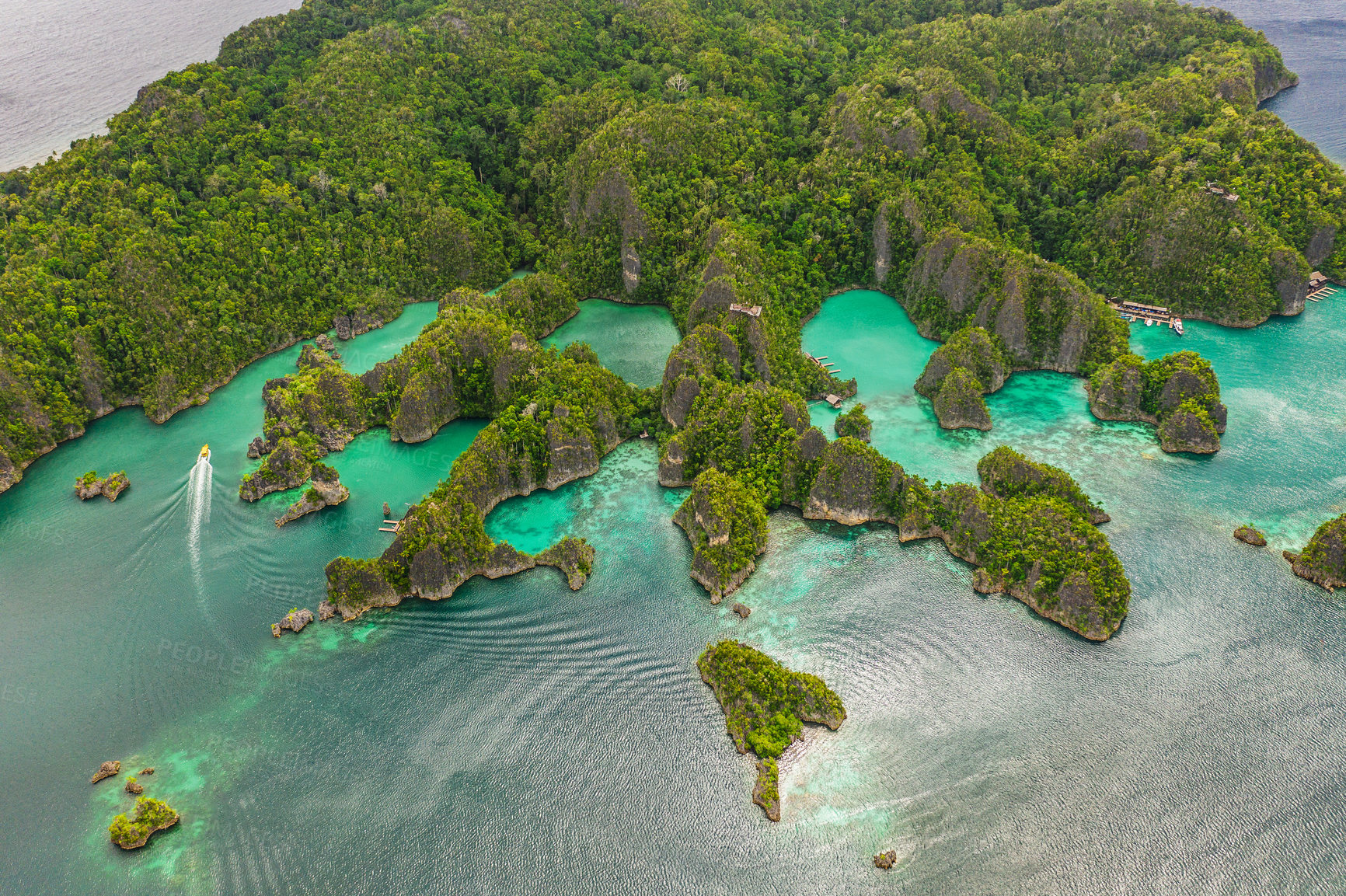 Buy stock photo High angle shot of a little islets and islands in the middle of Indonesia