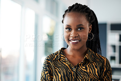 Buy stock photo Cropped portrait of an attractive young businesswoman standing alone in her office during the day