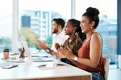 Buy stock photo Cropped shot of a diverse group of businesspeople sitting in the office together and clapping