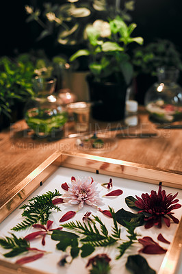 Buy stock photo Still life shot of a beautiful flower wall frame on a worktable at a flower boutique shop