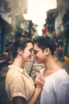 Buy stock photo Happy, travel and couple with forehead touch in city for vacation, sightseeing and holiday for romance. Date, love and woman hug man for bonding together in urban town for weekend trip in Vietnam.