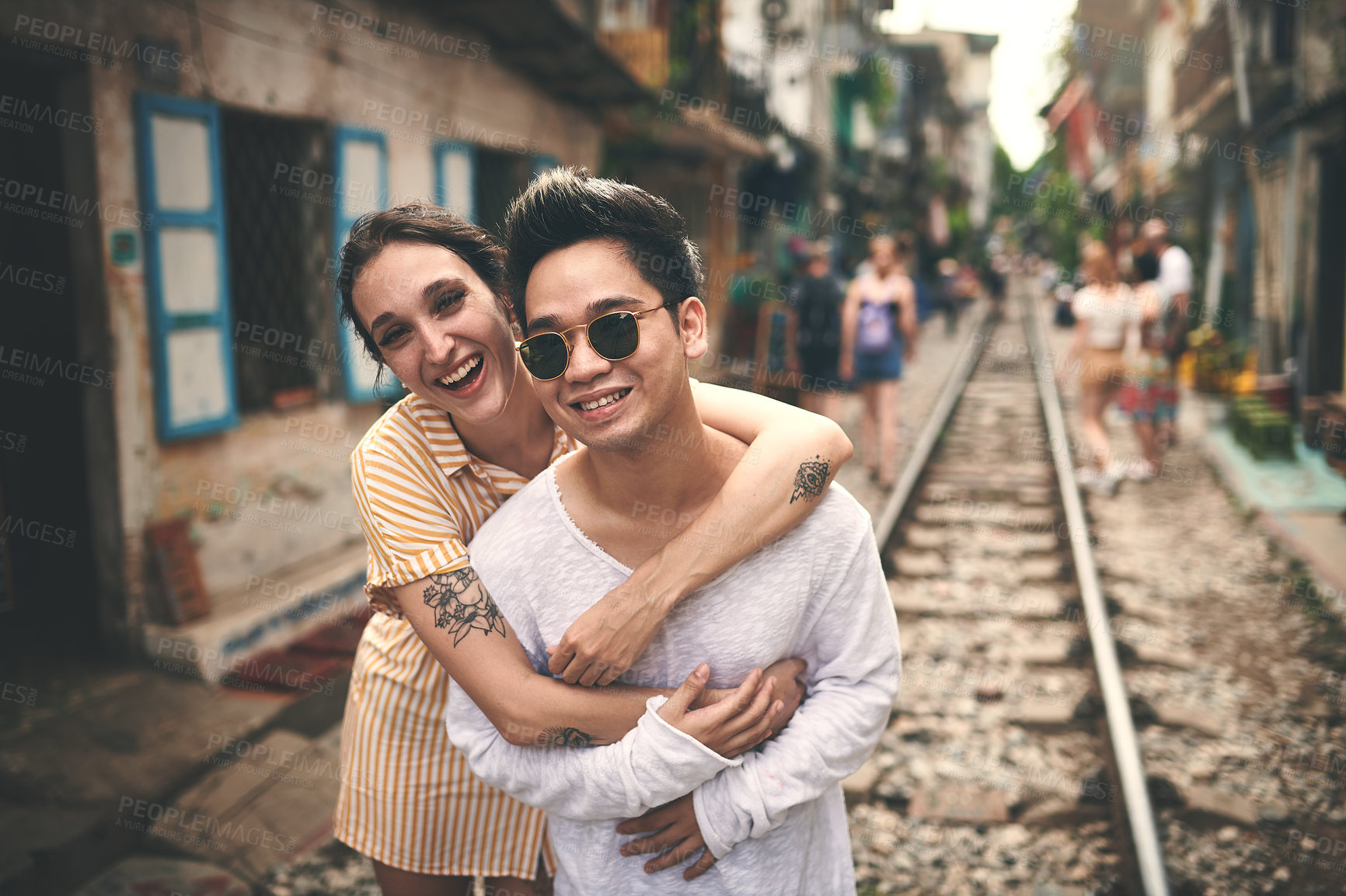 Buy stock photo Happy, portrait and couple hug in city for vacation, sightseeing and holiday for romance in relationship. Sunglasses, love and woman embracing man for bonding in town for weekend trip in Vietnam.