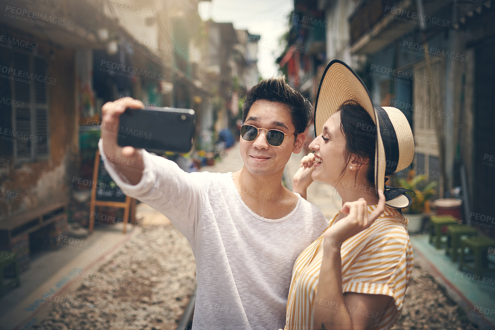 Buy stock photo Selfie, travel and couple in city on street for holiday, vacation and adventure on honeymoon. Bonding, love and happy man and woman take photo for social media, memory and profile picture in Vietnam