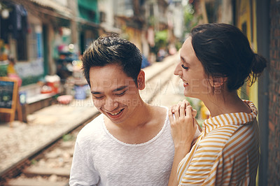 Buy stock photo Shot of a young couple sharing a romantic moment in the city of Vietnam