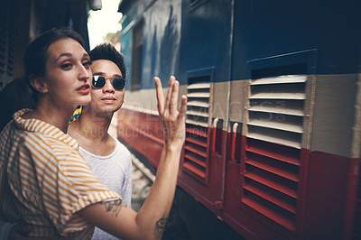 Buy stock photo Shot of a young couple about to board a train in Vietnam