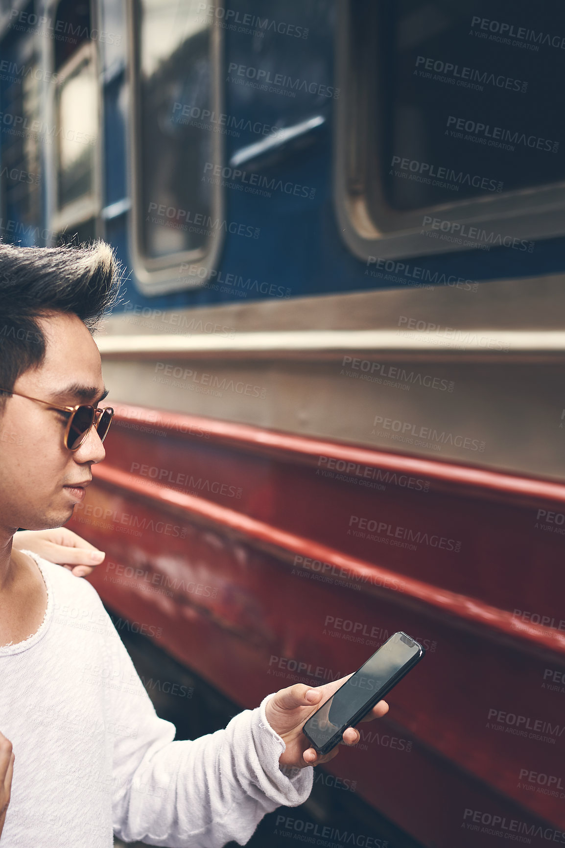 Buy stock photo Man, phone and travel with reading at train station with schedule, notification or delay on urban platform. Person, smartphone and railway transport in city with mobile app for commute in Vietnam