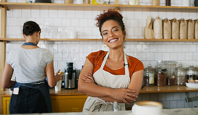 Buy stock photo Portrait of a young waitress standing behind a counter in a cafe