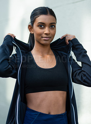 Buy stock photo Woman, face and confidence outdoor for fitness with sportswear, healthy body and runner in hoodie. Athlete, person and ready for workout, exercise or training routine with smile and wellness in city 