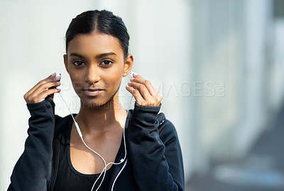 Buy stock photo Exercise, woman and listening to music outdoors for portrait from distraction by training, workout and fitness for health. Sport, athlete person and running with playlist or podcast for wellness 