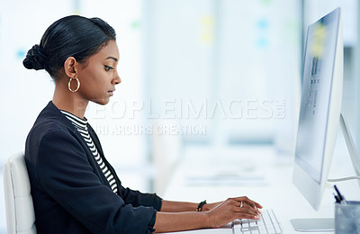 Buy stock photo Computer, business and Indian woman typing email, report or writing information in office. Serious, pc and professional consultant on keyboard for research online, reading or planning work project