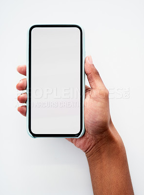 Buy stock photo Cropped shot of an unrecognizable businesswoman using her smartphone at work