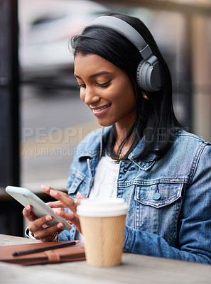 Buy stock photo Headphones, phone or happy Indian woman in cafe or city for streaming a song, music or radio. Smile, student or girl listening to audio on online subscription or social media with coffee on break