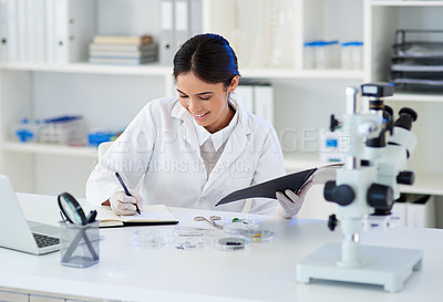 Buy stock photo Science, woman or writing in lab with medical research for sample analysis, leaves experiment or results on plant study. Scientist, expert or notes on sustainable healthcare or herb medicine progress