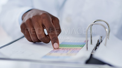Buy stock photo Pointing, hand and book in lab, scientist and medicine of periodic table, innovation and future for health. Workplace, finger and science of discovery, career and job as pharmaceutical and expert