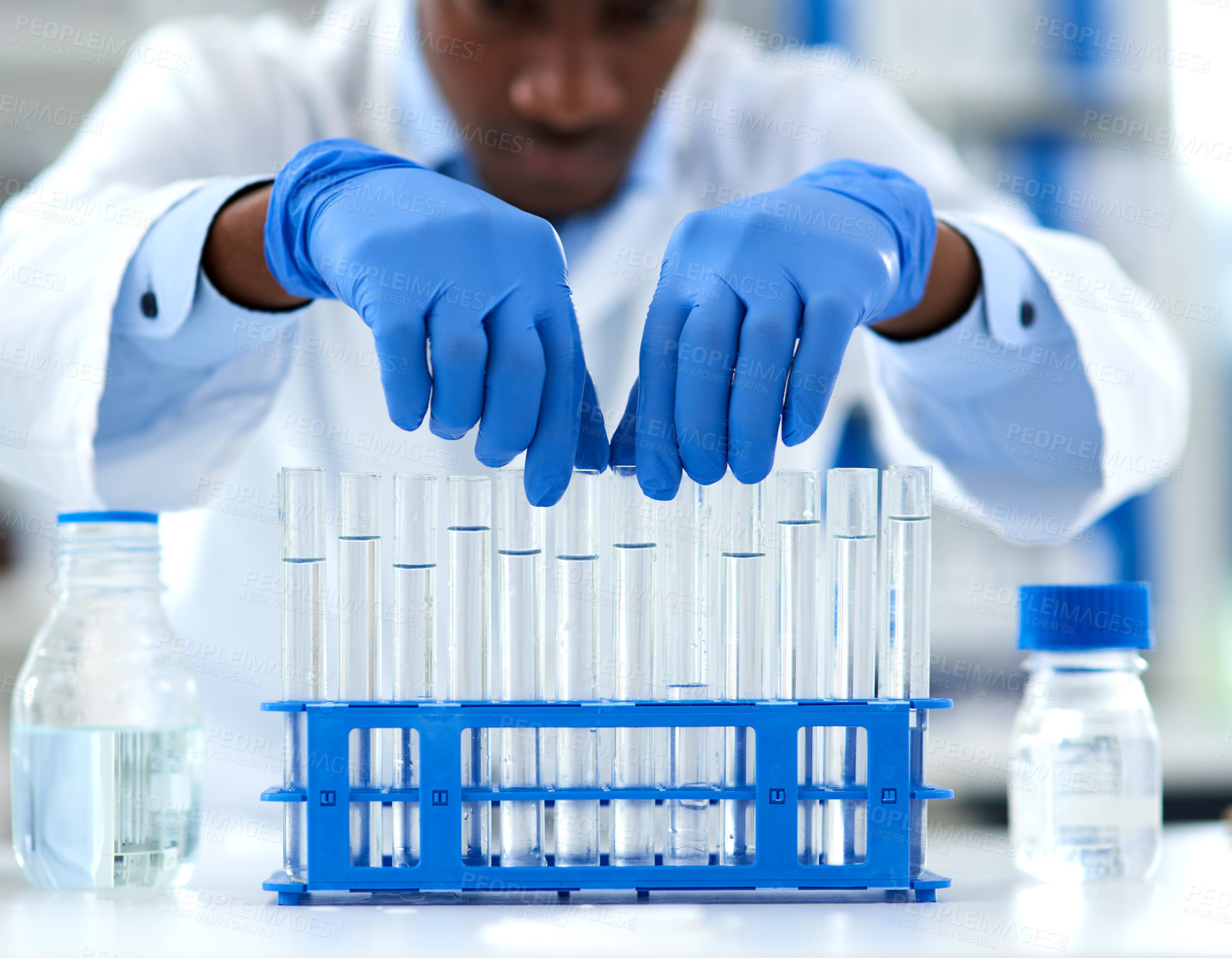 Buy stock photo Scientist, test tubes and medical development for drugs, medicine and pharmaceutical research. African doctor, laboratory and discovery for innovation, life extension and professional biochemistry