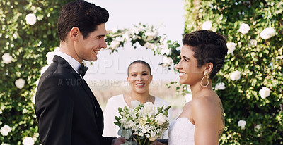 Buy stock photo Cropped shot of an affectionate young couple smiling at each other while saying their vows on their wedding day