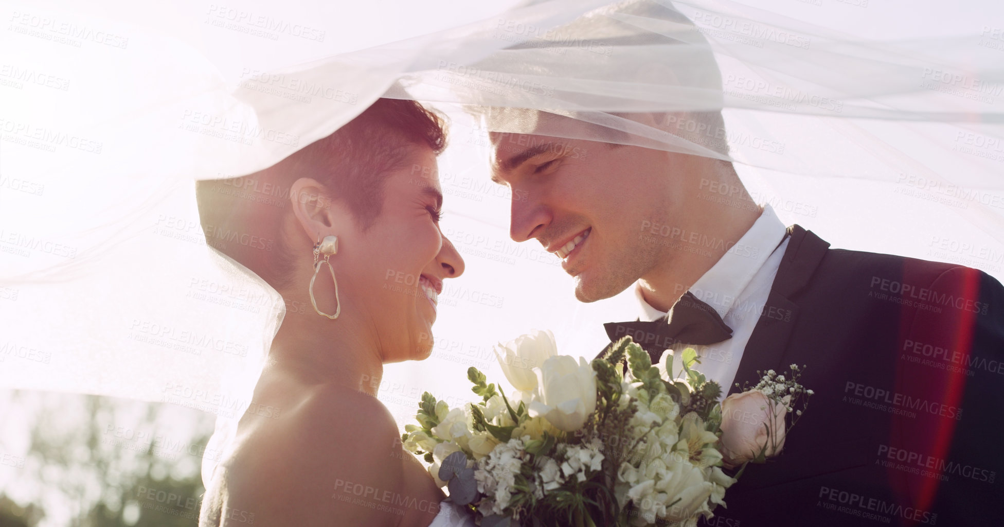 Buy stock photo Couple, marriage and wedding veil for love in outdoor, romance and commitment at ceremony. People, flowers and loyalty in relationship, partnership and trust in support or together for celebration