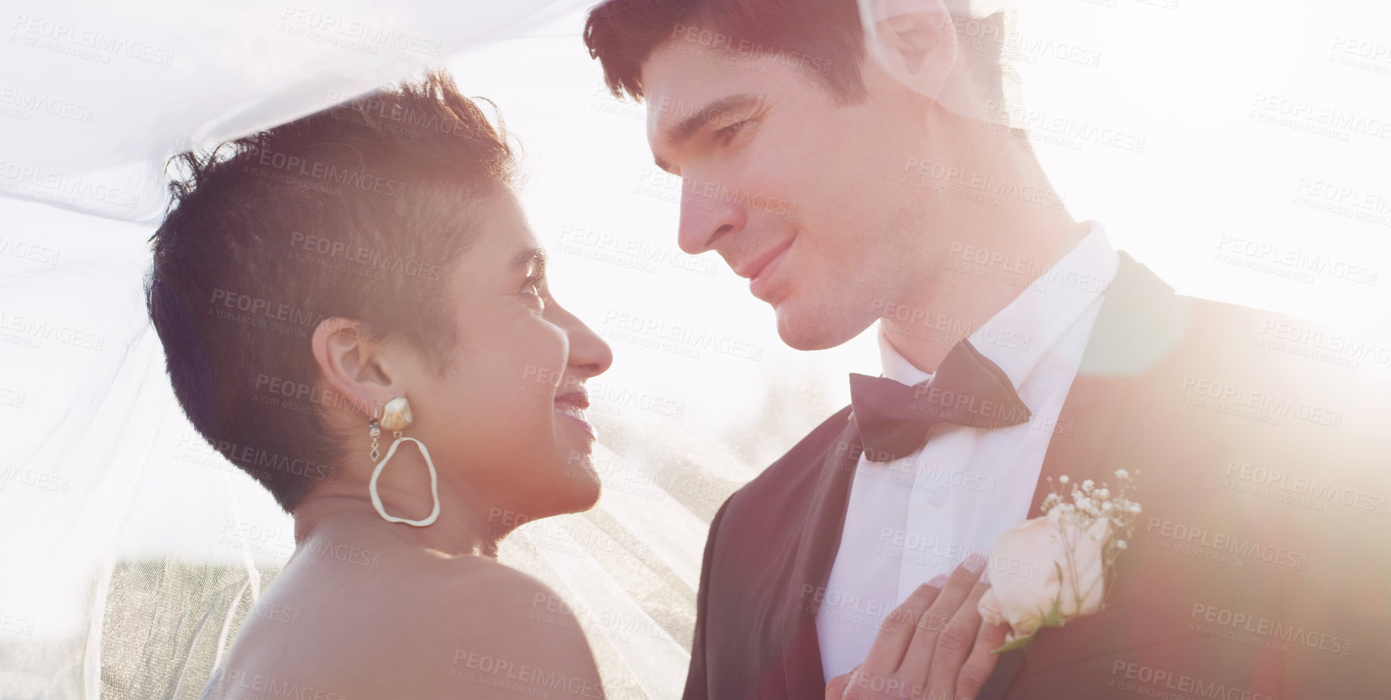 Buy stock photo Couple, smile and wedding veil in outdoor for unity, marriage and commitment at ceremony. People, touch and loyalty in relationship, partnership and trust in support or together for celebration