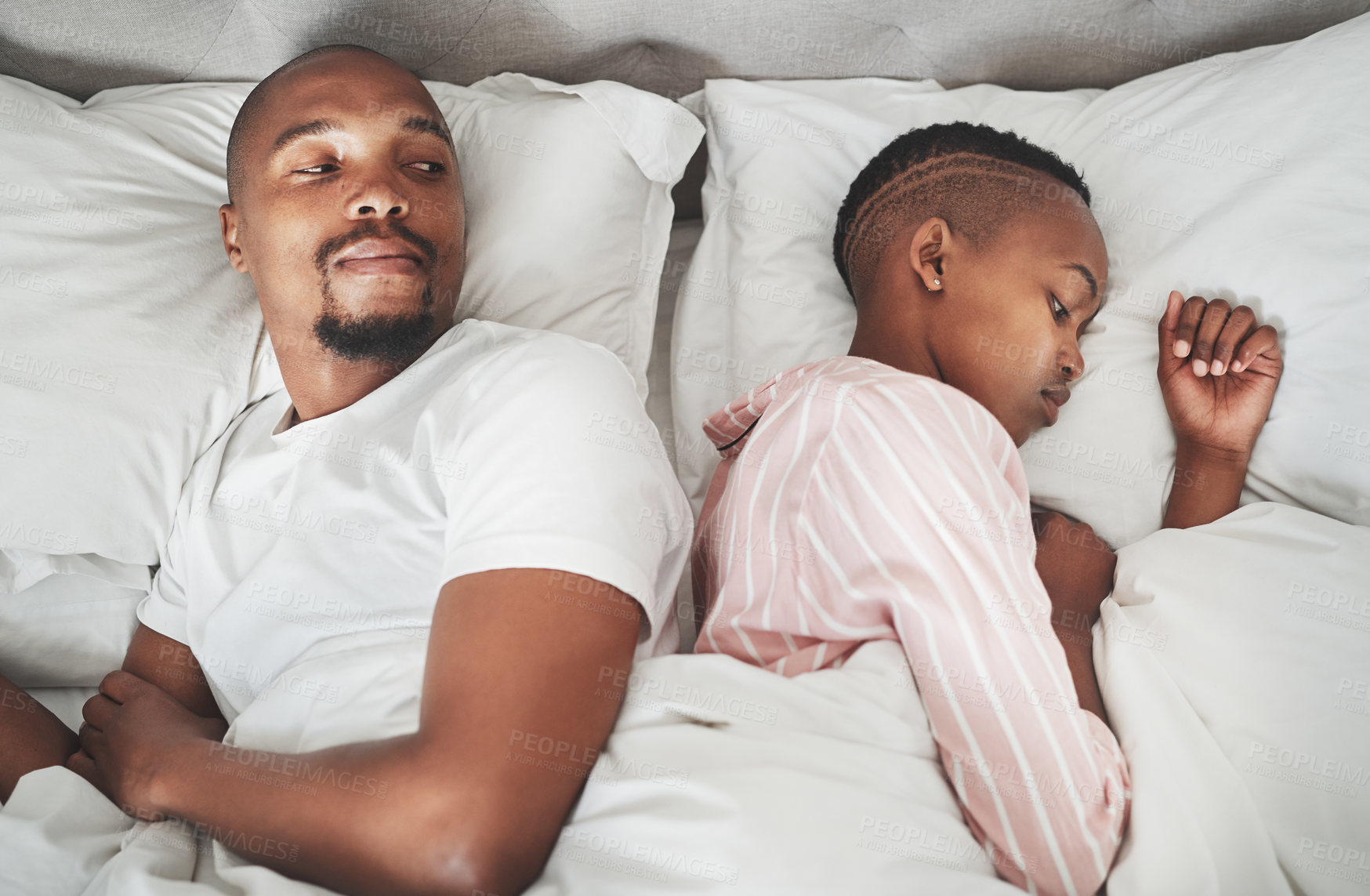 Buy stock photo Sad, conflict and black couple in bed after a fight, communication fail and divorce from above. Mental health, angry and African man and woman with anger, frustrated and problem in the marriage