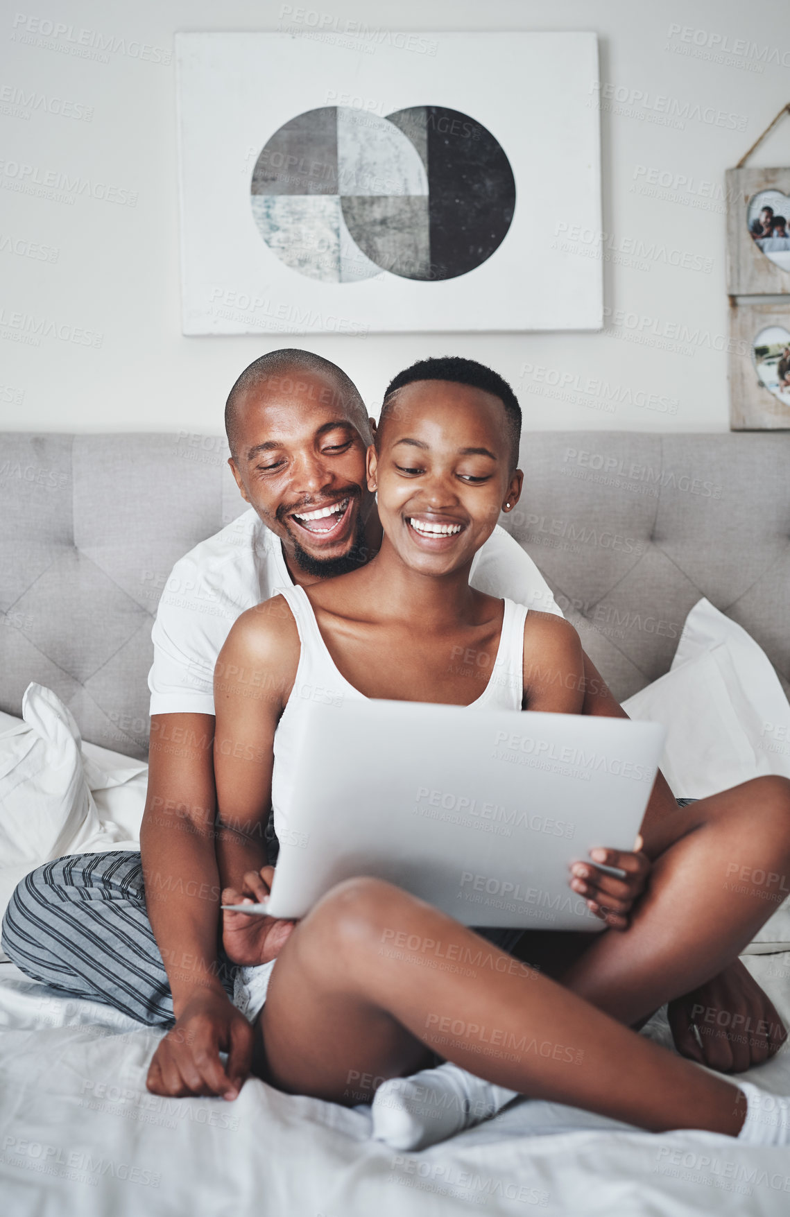 Buy stock photo Love, technology and black couple in bed with laptop to watch movie on valentines day date in home. Movies, streaming and romance for man and woman in bedroom, happy with smile and internet service.