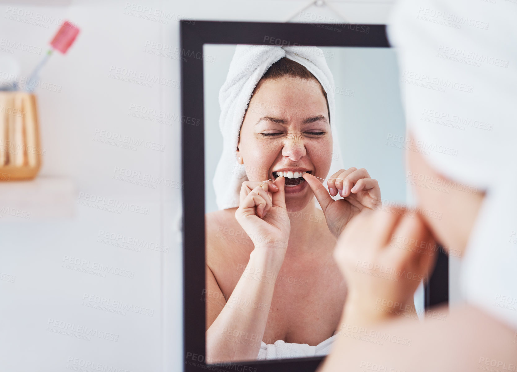 Buy stock photo Woman, mirror and dental floss in morning, home and process for teeth whitening, routine and hygiene. Person, cleaning and reflection with benefits for fresh breath, wellness and happy at apartment