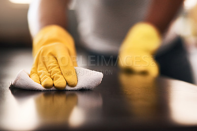 Buy stock photo Cropped shot of an unrecognizable man cleaning a kitchen counter at home
