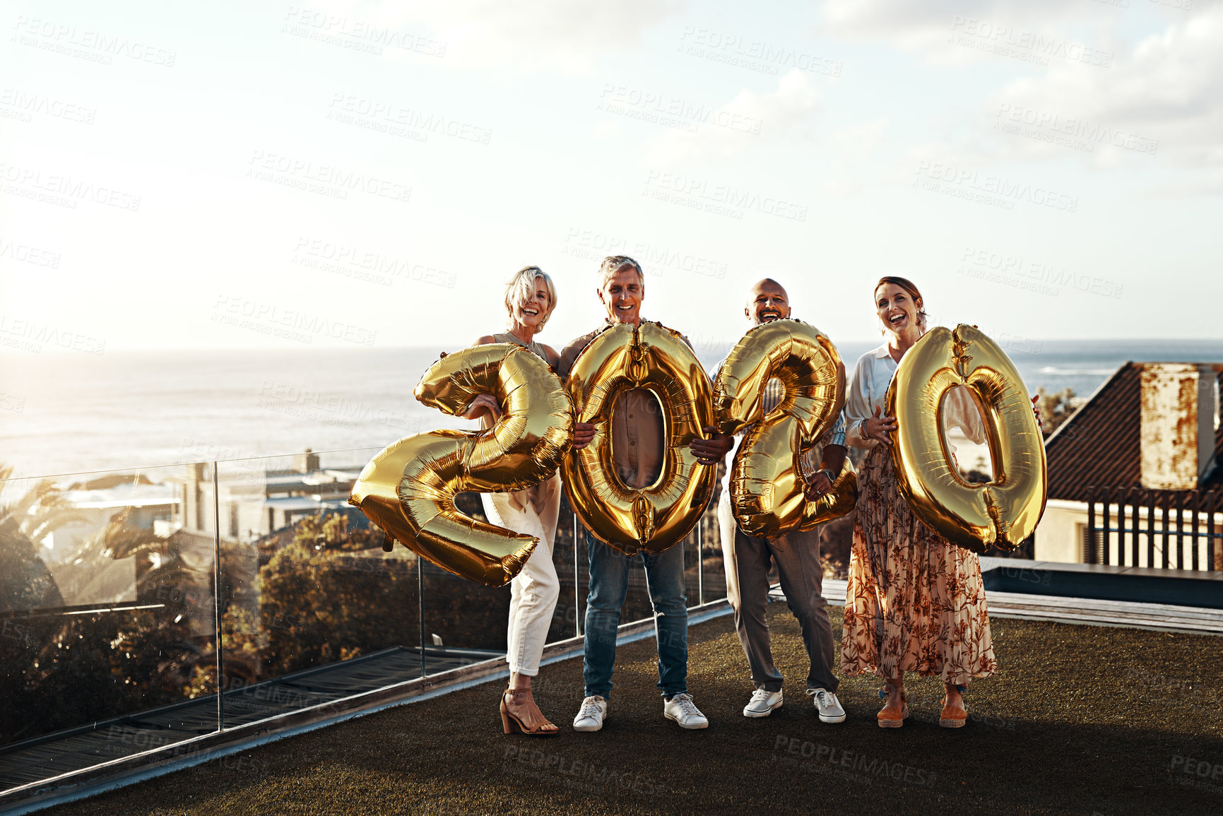 Buy stock photo Full length portrait of an affectionate family holding up balloon numbers reading 