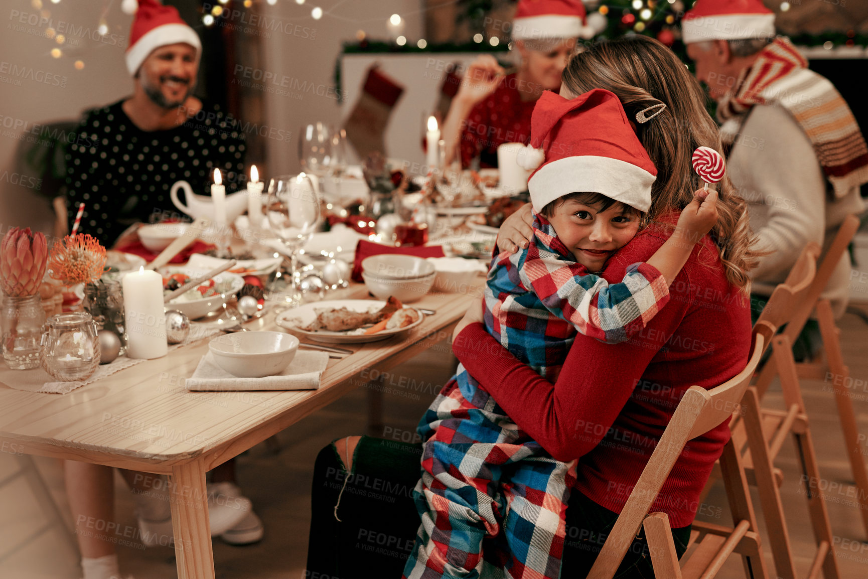 Buy stock photo Family, christmas dinner and festive holiday, event and happy smile in house  at table, decoration and celebration. Mother, father and boy kid with grandparents to celebrate Xmas in family home