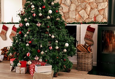 Buy stock photo Christmas tree, present and holiday living room in winter with house decoration and gifts. Home gift giving and celebrating tradition with trees in the morning ready for a festive party in household