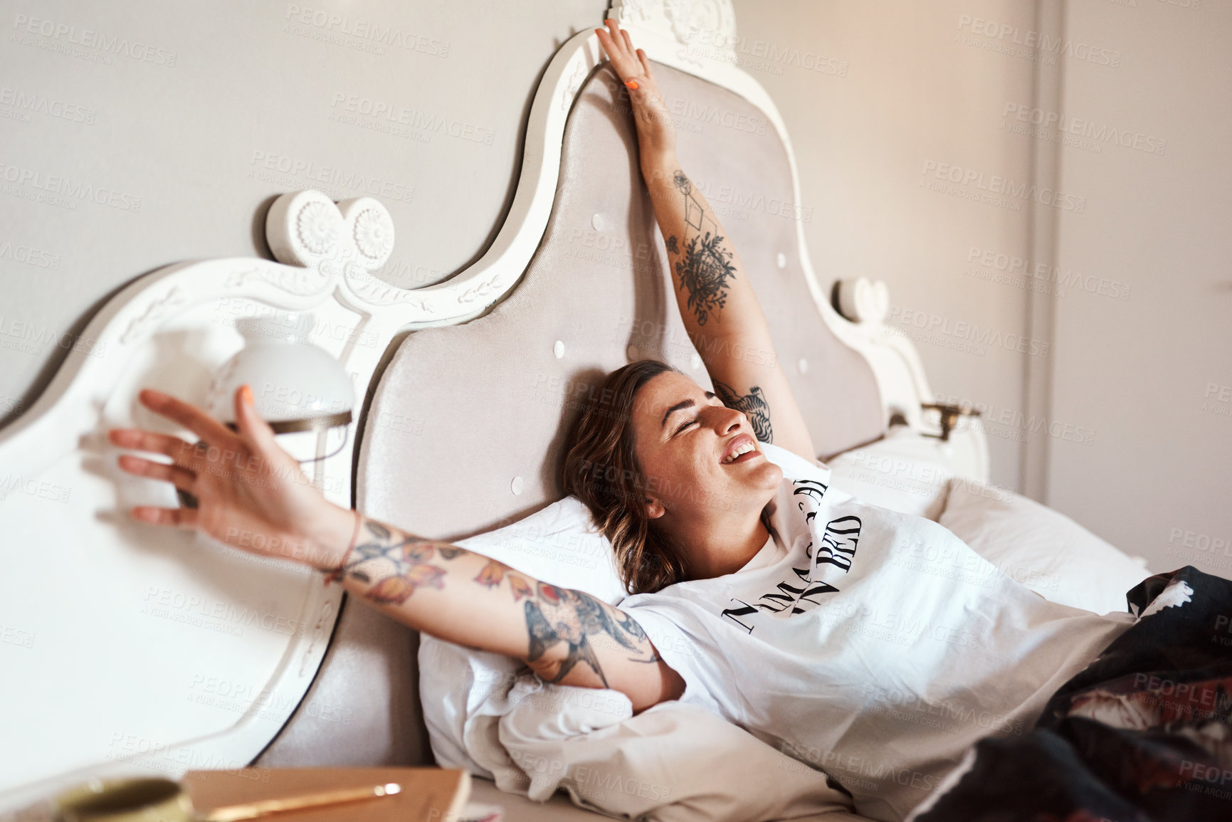 Buy stock photo Cropped shot of a happy young woman waking up from her sleep