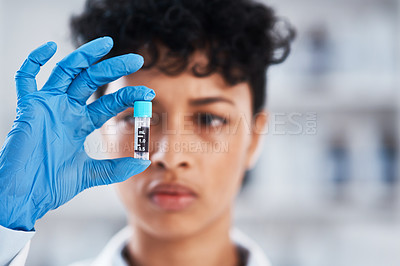 Buy stock photo Closeup shot of a young scientist working with samples in a lab