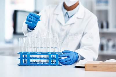 Buy stock photo Closeup shot of an unrecognisable scientist using a dropper while working in a lab