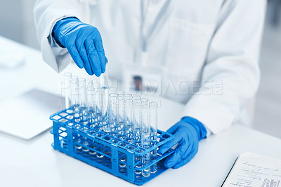Buy stock photo Closeup shot of an unrecognisable scientist working with samples in a lab