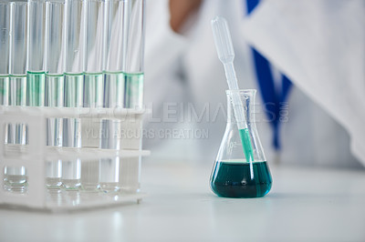 Buy stock photo Cropped shot of a scientist conducting an experiment in a laboratory