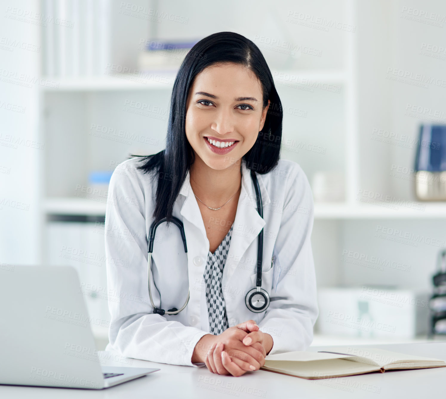 Buy stock photo Portrait of a young doctor working at her desk