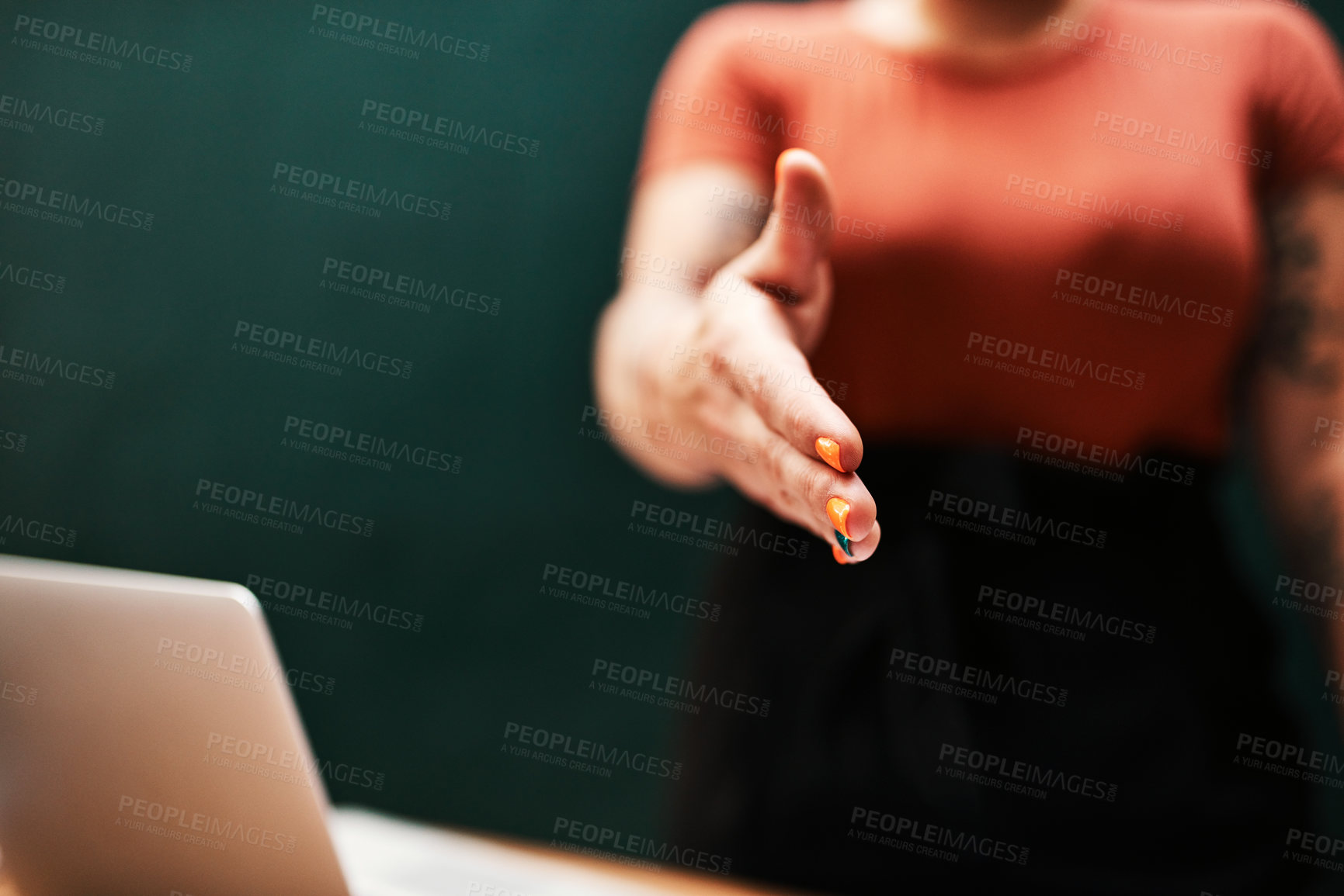 Buy stock photo Cropped shot of an unrecognizable businesswoman standing alone and holding out her hand for a handshake