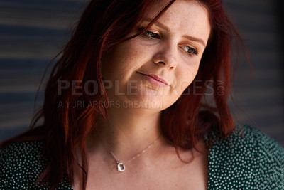 Buy stock photo Cropped shot of a beautiful young woman standing outside against a grey background