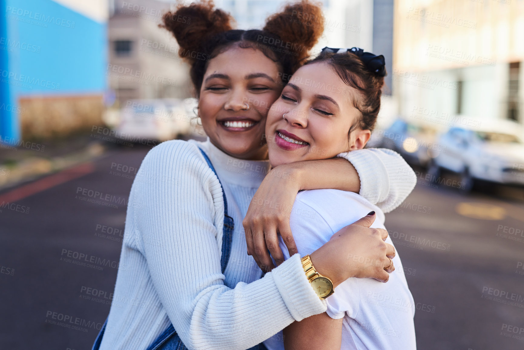Buy stock photo Cropped shot of two young woman out in the city during the day