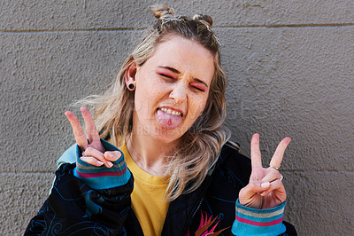 Buy stock photo Cropped shot of a young woman making the peace gesture with both of her hands