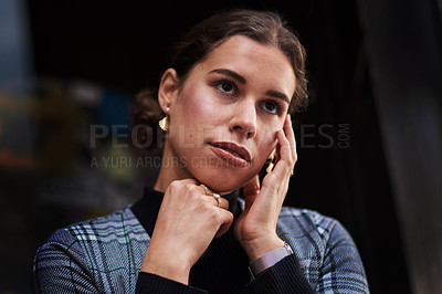 Buy stock photo Cropped shot of a beautiful young woman out in the city