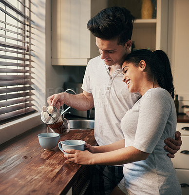 Buy stock photo Cropped shot of a young couple pouring their morning coffee