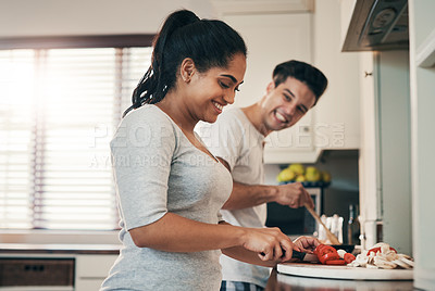 Buy stock photo Couple, cooking and laugh with talking in kitchen for funny memory, joke and helping hand for meal prep. Woman, man and smile with chat, bonding or connection with love, vegetables or food for diet