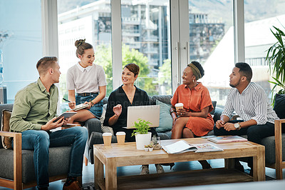 Buy stock photo Cropped shot of a diverse group of businesspeople sitting in the office together and having a meeting