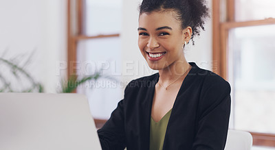 Buy stock photo Cropped portrait of an attractive young businesswoman smiling while using a laptop in her office during the day