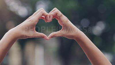 Buy stock photo Closeup, hands and woman with a heart shape, city and solidarity with support, care and review. Zoom, female person and girl outdoor, symbol and love with feedback, motivation and sign with emoji