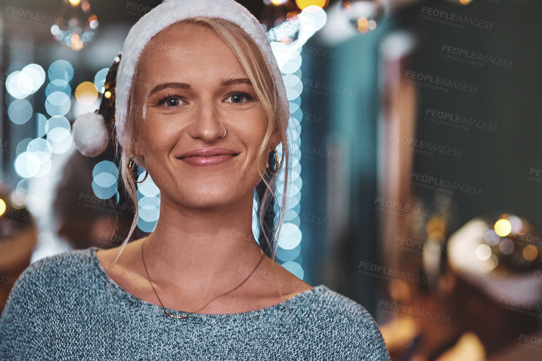 Buy stock photo Portrait of a cheerful young woman wearing a festive hat at home during christmas time