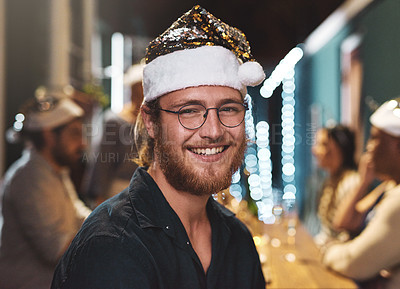 Buy stock photo Portrait of a cheerful young man wearing a festive hat at home during christmas time