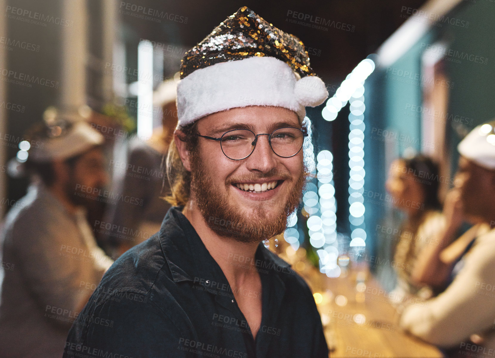 Buy stock photo Portrait of a cheerful young man wearing a festive hat at home during christmas time