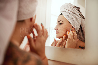 Buy stock photo Beauty, acne and woman cleaning her face for skincare morning routine in her bathroom in a home or house. Facial, pimple and female person doing cosmetic self love or care in her house mirror