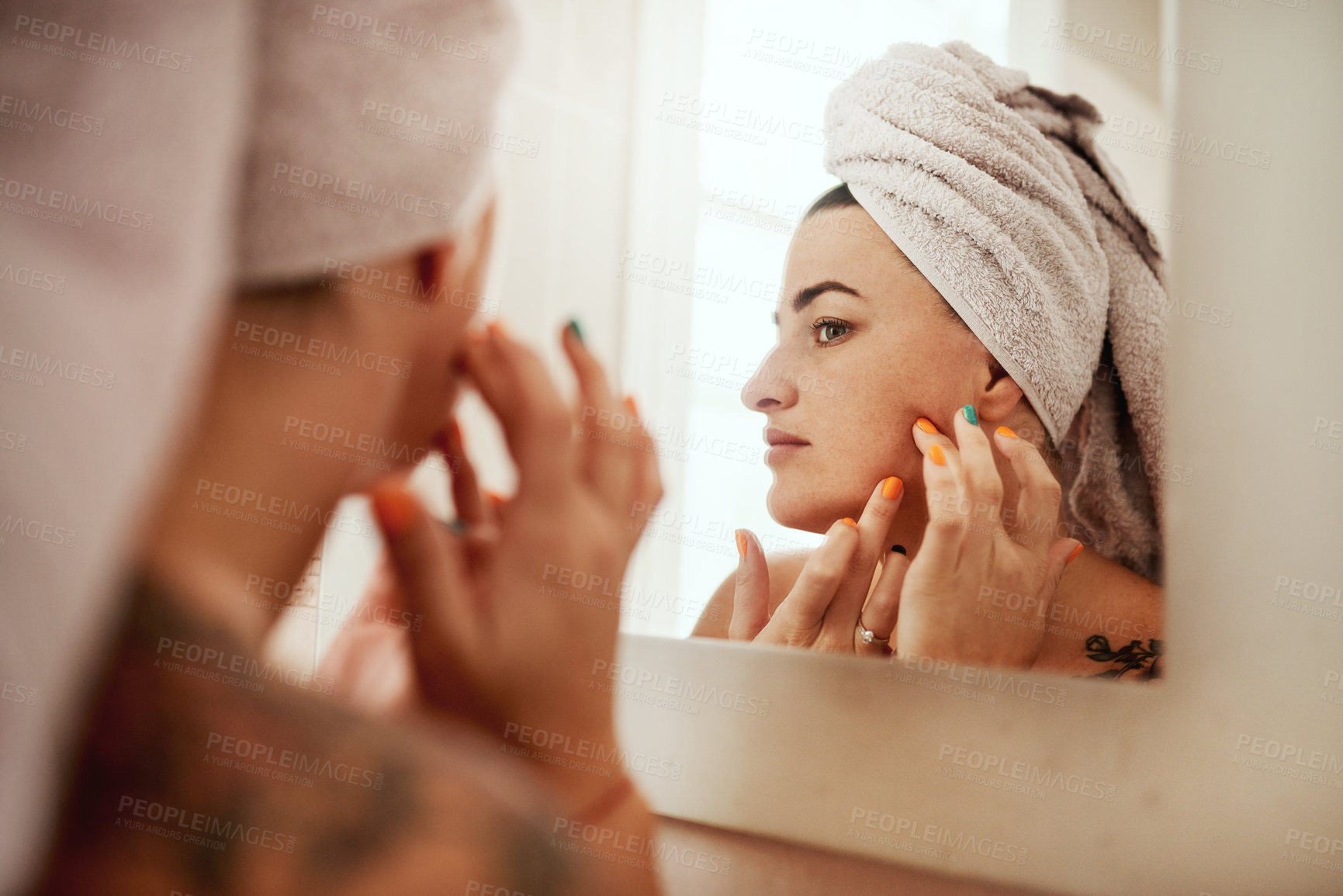 Buy stock photo Beauty, acne and woman cleaning her face for skincare morning routine in her bathroom in a home or house. Facial, pimple and female person doing cosmetic self love or care in her house mirror